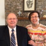 two older white people wearing formal-wear.