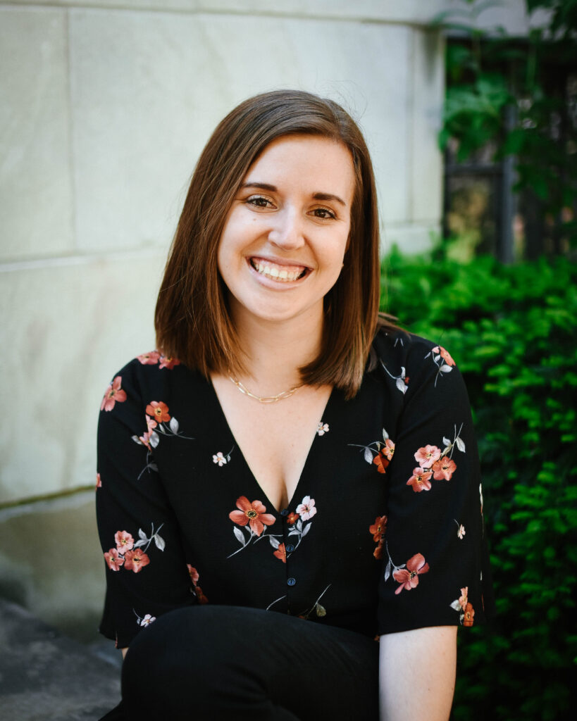 Keli is a young adult white female with shoulder-length straight brown hair.