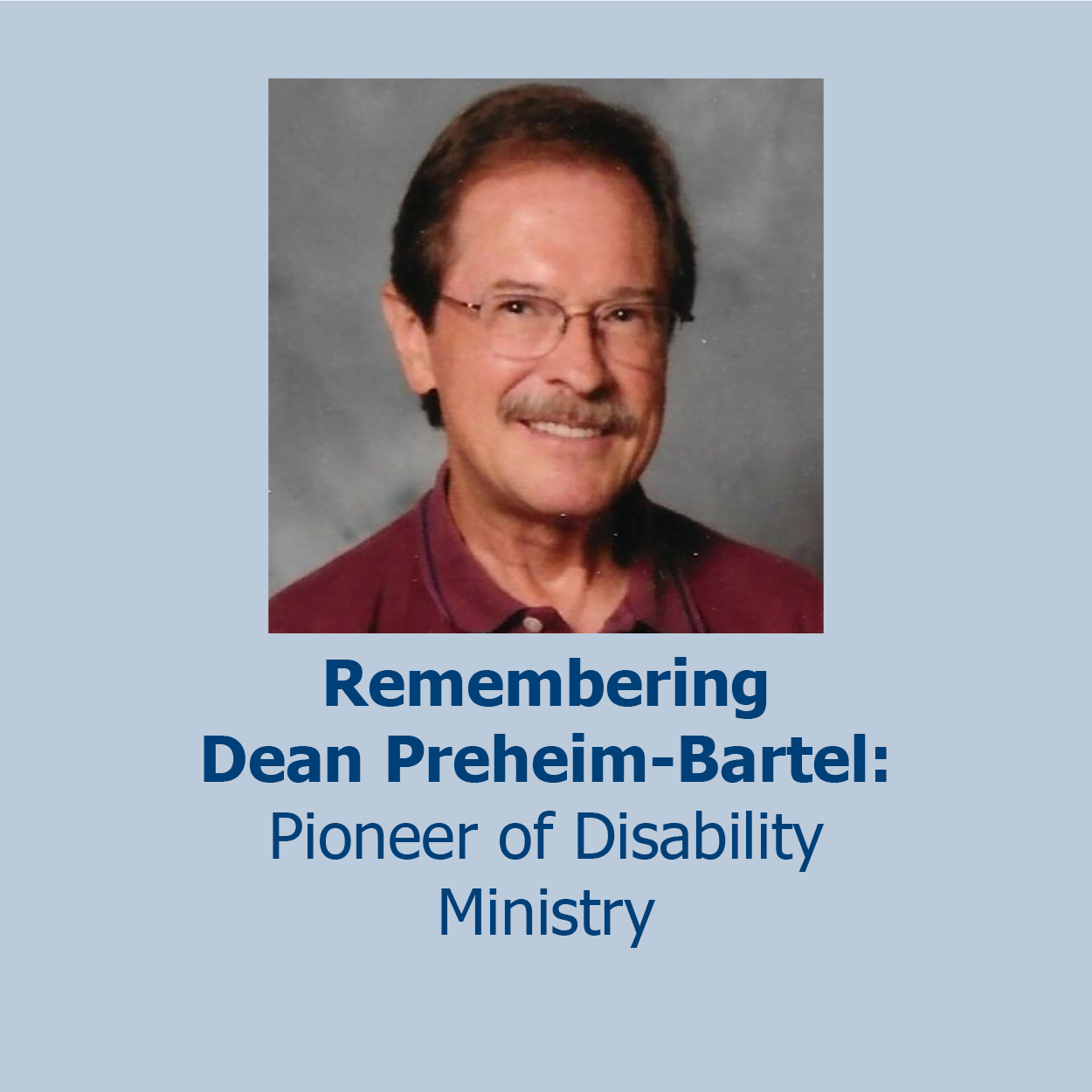 Photo of Dean in a red button shirt smiling