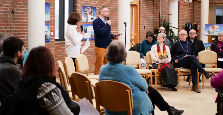 Keith Dow talks to a group during a vespers service