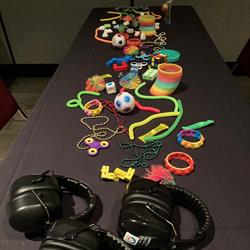 table of fidgets and noise-reducing headphones