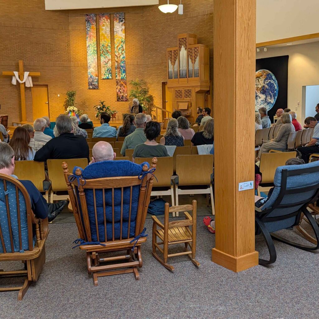 rocking chairs of various sizes at the back of a sanctuary